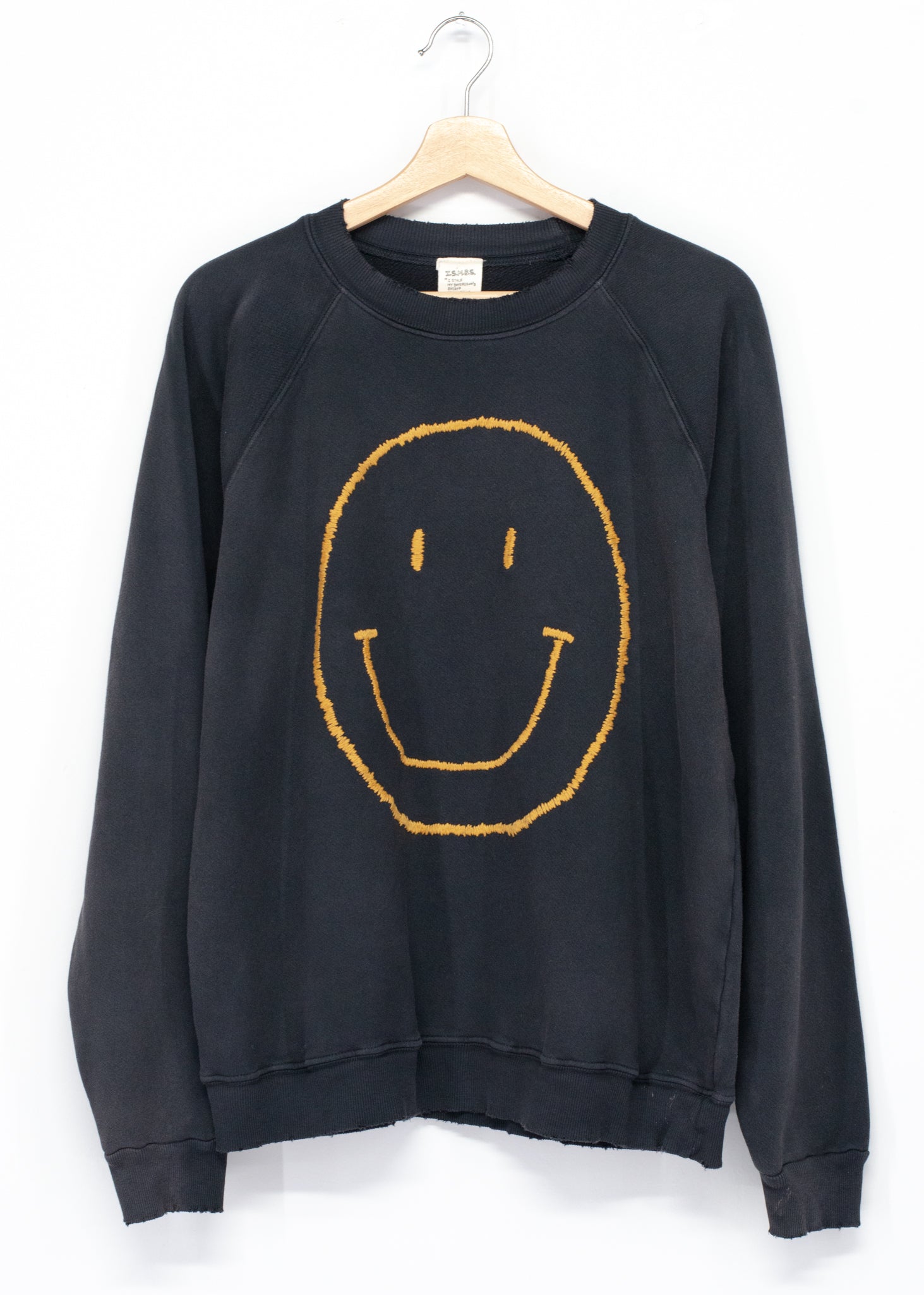 Black sweater discount with smiley faces