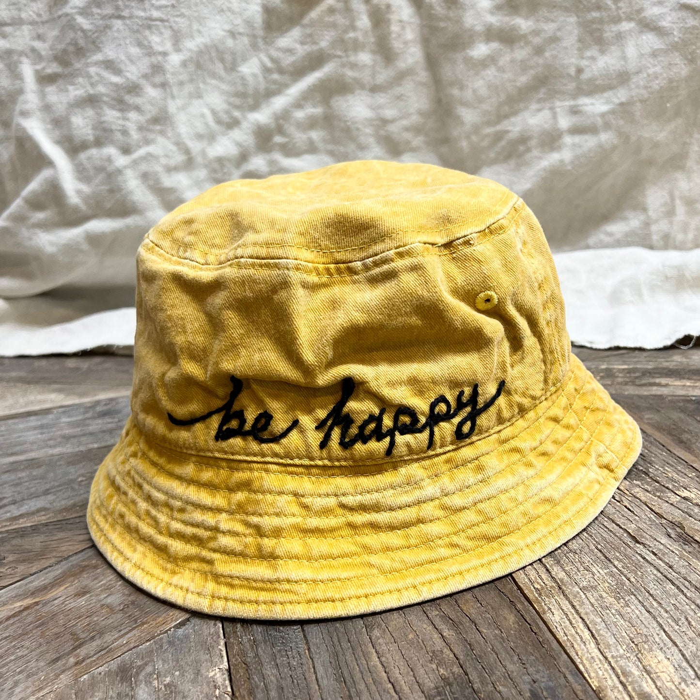 WASHED COTTON BUCKET HAT WITH CUSTOM HAND EMBROIDERY- FADED SUN